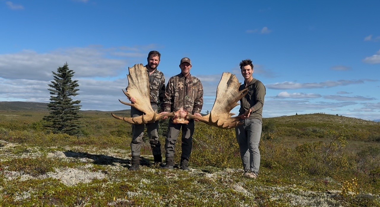 Hunters in Alaska field country after a moose hunt